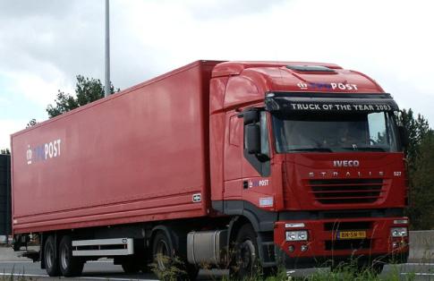 iveco articulated lorry on the road transporting freight